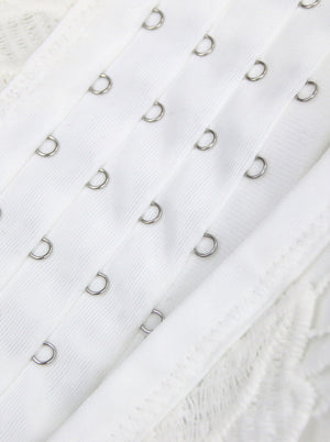 Vista dettagliata bianca del reggiseno del reggiseno del partito del corsetto del corsetto del pizzo floreale gotico d'annata regolabile